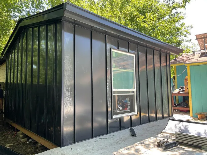 Black standing seam metal wall panels for Metal Roof Installation in Chain Lake