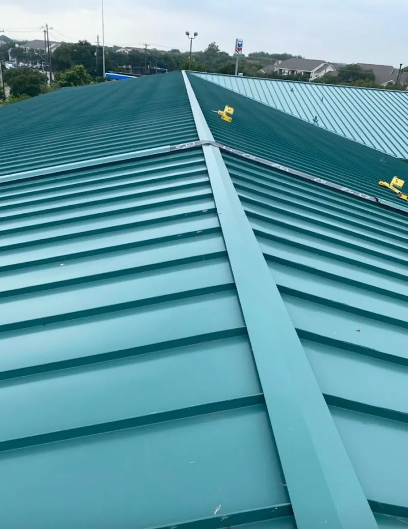 Green commercial metal roof ridge and valley for Metal Roof Repair in Chain Lake